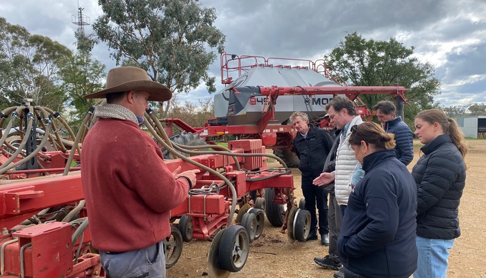 Stuart McDonald from Canowindra shows the group his single-disc seeder